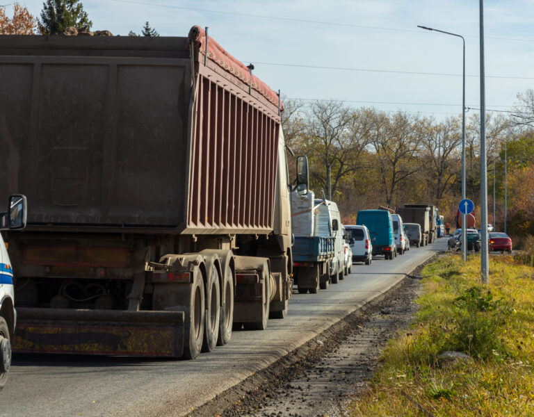 Traffic jam on busy road cars in row