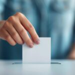 Person Casting Ballot In Election