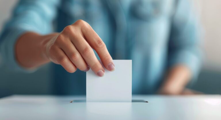 Person Casting Ballot In Election